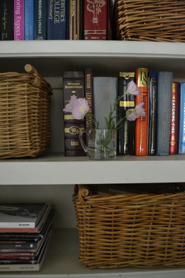 organize your bookcase with baskets and lace cottage fix