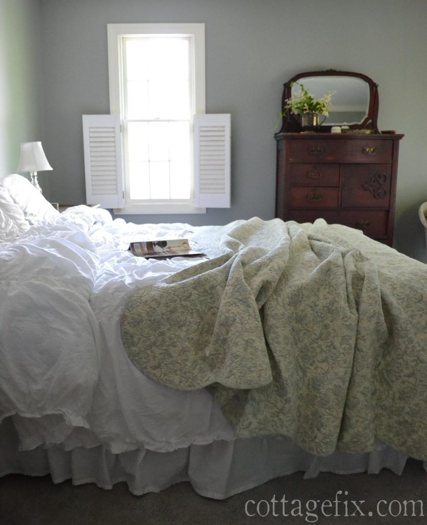 Cottage Fix blog - bedroom with gray walls, flouncy bedding, and a toile quilt