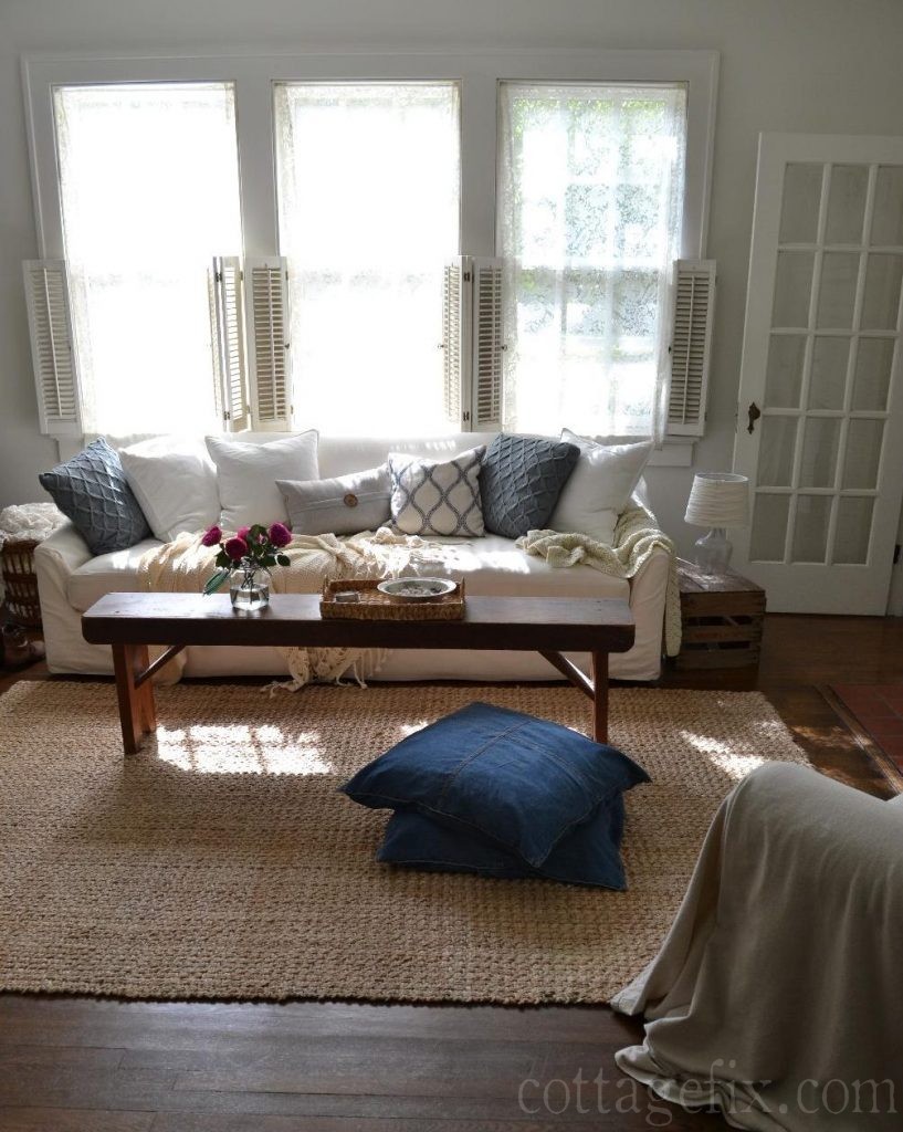 Cottage Fix blog - cottage living room with dark gray knits and blues